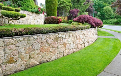 green lawn and stone walls